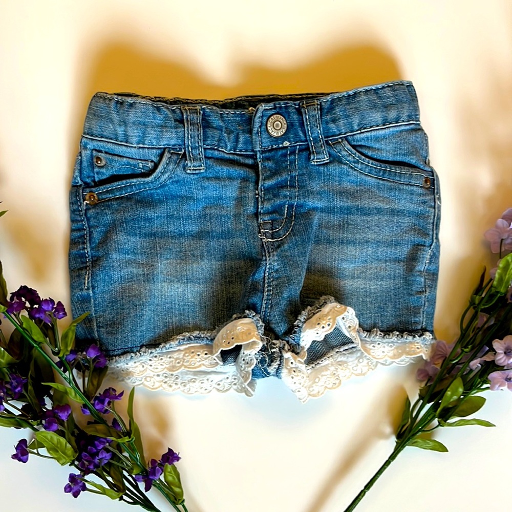 GENTLY WORN 18mo CAT & JACK girls light blue denim shorts with lace detail.